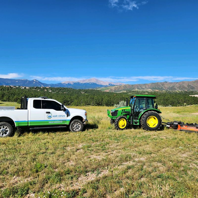 A&R Open Land Mowing truck and tractor on a Colorado Springs job