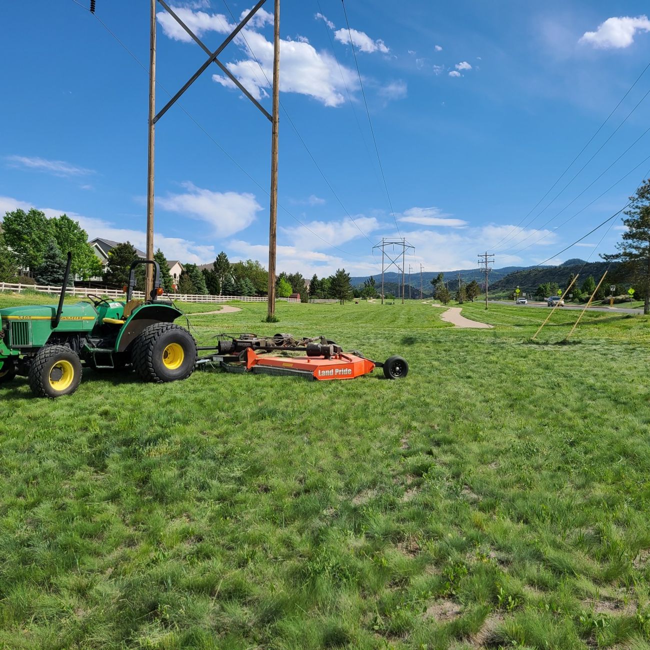 A&R Open Land Mowing tractor cutting a large native grass field