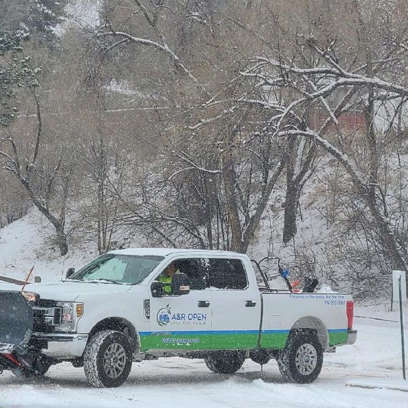 Plowed snow at a Colorado Springs commercial lot